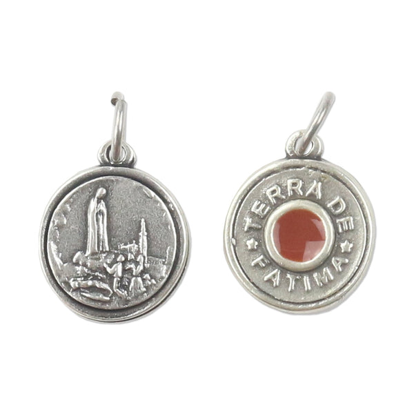 Medal of Fatima with ground soil