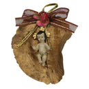 Baby Jesus on dry leaf