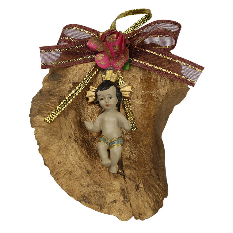 Baby Jesus on dry leaf